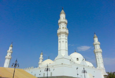 Low angle view of building against blue sky