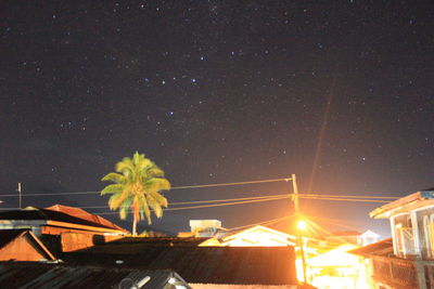 Low angle view of illuminated star field against sky at night