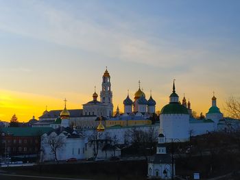 Buildings against sky during sunset