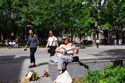 People walking on road in city