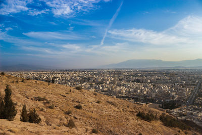 Aerial view of cityscape against sky