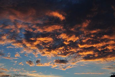 Low angle view of dramatic sky during sunset