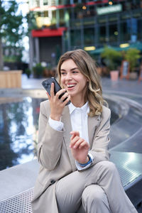 Young woman using mobile phone