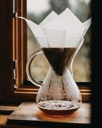 Close-up of coffee cup on table