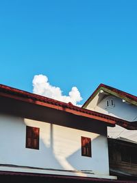 Low angle view of building against clear blue sky