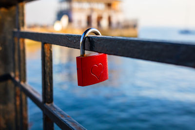 Red padlock with a heart shape on it