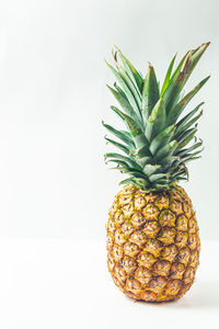 Close-up of fruit against white background