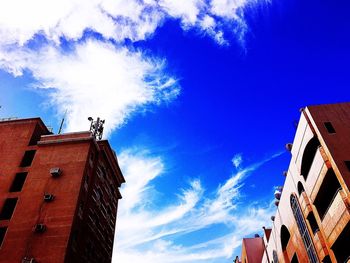 Low angle view of building against blue sky