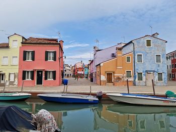 Boats moored at harbor