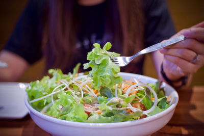Midsection of woman holding food