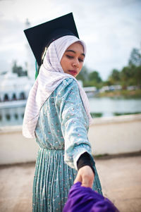Low angle view of girl on water