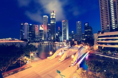 High angle view of city lit up at night