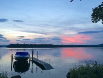 Scenic view of calm lake at sunset