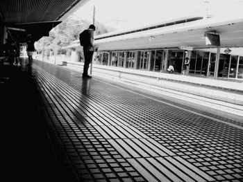 Man waiting on railway station platform