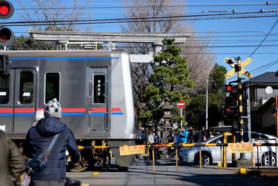 Train on street against sky