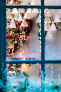 Close-up of christmas decoration seen through window