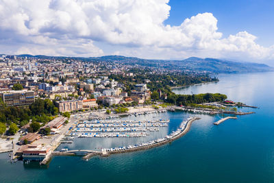 High angle view of city against cloudy sky