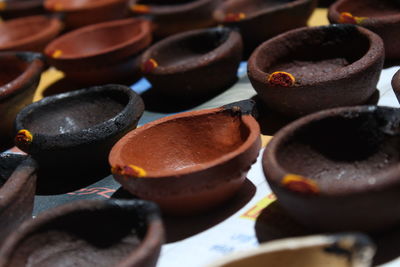 Artistic homemade clay oil lamps or karthikai deepam are ready for diwali and karthikai festivals