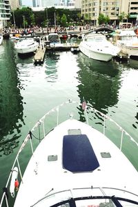 High angle view of boats moored at harbor