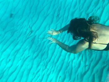 High angle view of woman swimming undersea