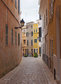 Narrow alley amidst buildings in town