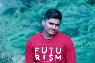 Portrait of young man standing outdoors