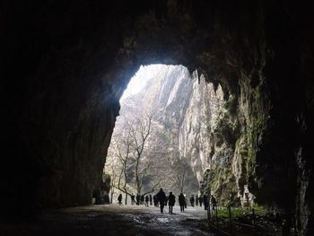 People walking in cave