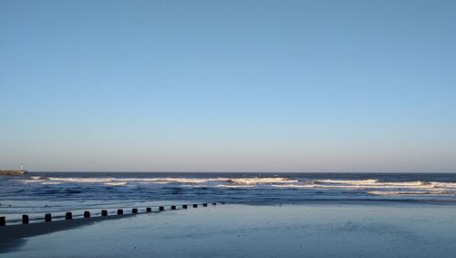 Scenic view of sea against clear sky