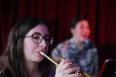 Young women playing musical instruments