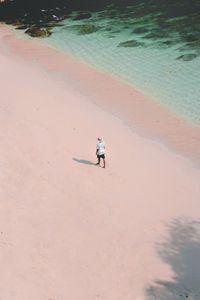 High angle view of man walking at beach