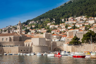 Dubrovnik city old port marina and fortifications seen from porporela