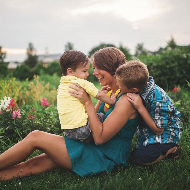 togetherness, bonding, leisure activity, lifestyles, love, childhood, casual clothing, family, boys, girls, family with one child, friendship, elementary age, sibling, grass, sitting, mother