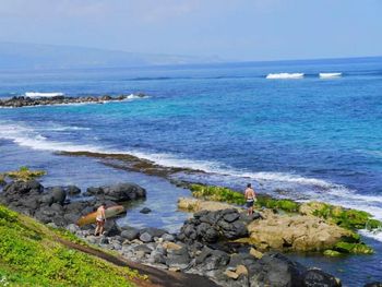 Scenic view of sea against blue sky