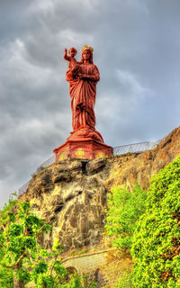 Low angle view of statue against sky