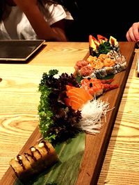 Midsection of sushi in plate on table