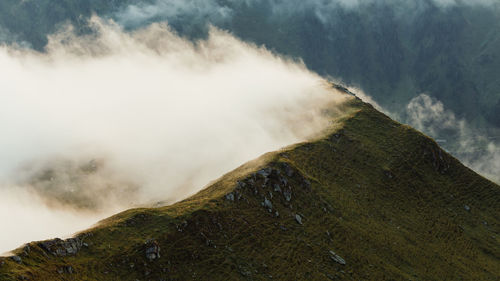 Scenic view of volcanic mountain against sky