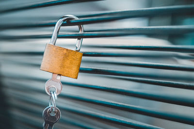 Close-up of padlock hanging 