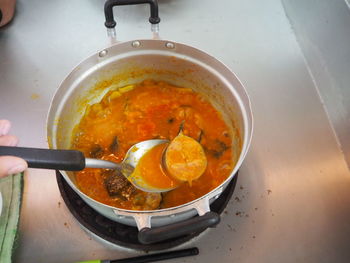 High angle view of meat in cooking pan