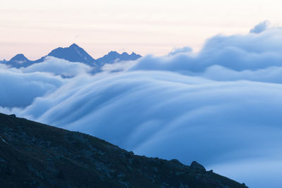 Low angle view of mountain range against sky