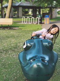 Smiling girl playing at jungle gym