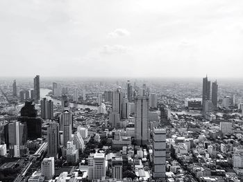 High angle view of modern buildings in city against sky