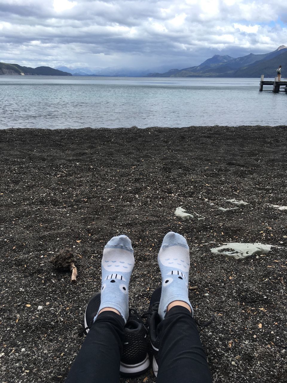 sea, shoe, low section, human body part, personal perspective, water, standing, outdoors, human leg, cloud - sky, sky, horizon over water, one person, day, men, beach, beauty in nature, nature, people, adult, adults only, one man only