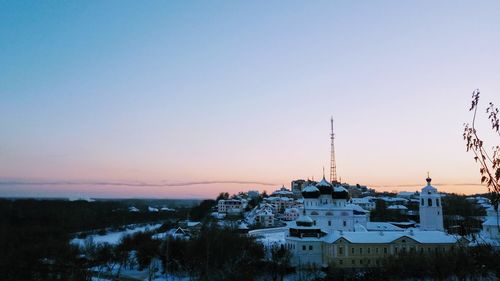 Cityscape against sky during sunset