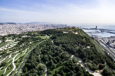 Aerial view of townscape by sea