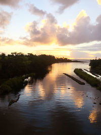 Scenic view of lake against sky during sunset