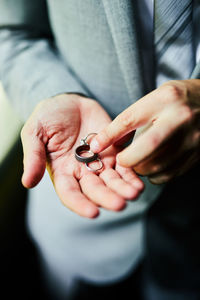 Close-up of man holding hands