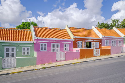 Houses in city against sky