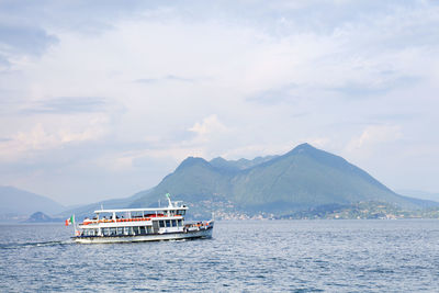 Ship sailing on sea against sky