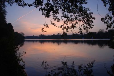 Scenic view of lake against sky during sunset