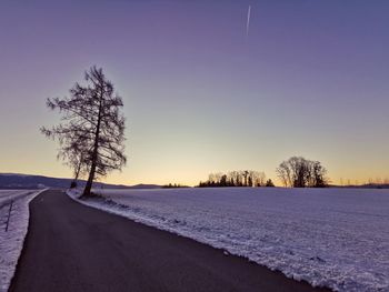 Scenic view of snow covered landscape against sky